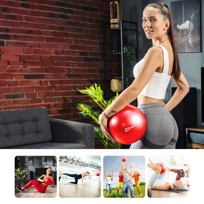 modelka wykonuje brzuszki z czerwoną piłką gimnastyczna 25cm marki Hop-Sport